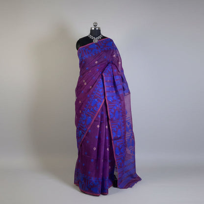 Purple and blue saree on a mannequin against a plain background