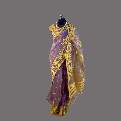 Purple saree with yellow patterns on a mannequin against a plain background