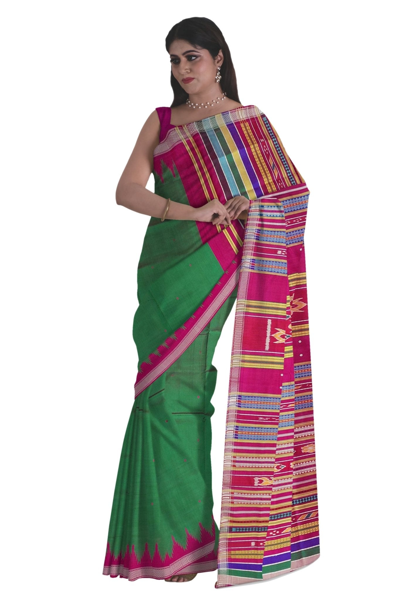 A woman modeling a green silk saree with a vibrant magenta border and a multicolored striped pallu, set against a plain white background.Side drape with sleeveless blouse and temple border.