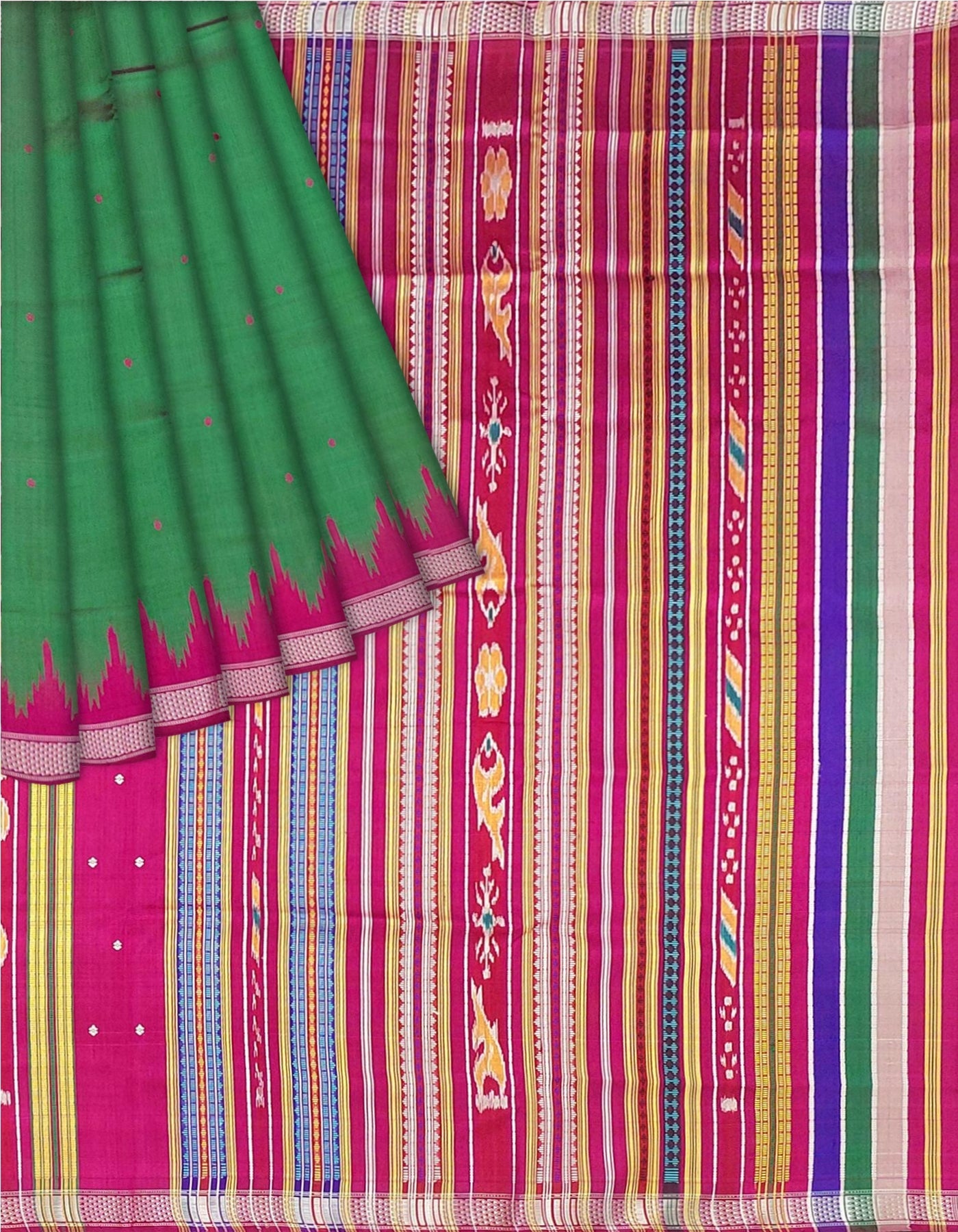 A close-up of a patterned fabric, likely a saree, featuring a solid green drape on the left with a pink and magenta border, and a highly detailed multicolor striped and geometric woven body on the right.Close-up flat lay of Kumbha motifs and weave.